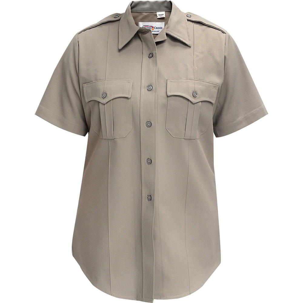 Product shot of a King Cross short-sleeved beige women's uniform shirt featuring a button-down front, two flap pockets, and a tailored fit