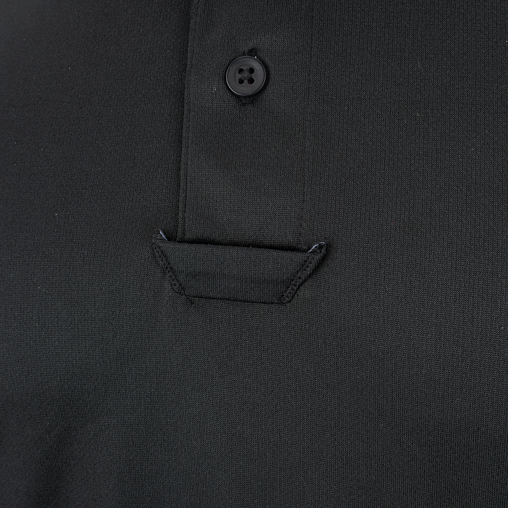 Close-up photograph of a black polo shirt showcasing a unique angled pocket, four-button placket, and subtly textured fabric