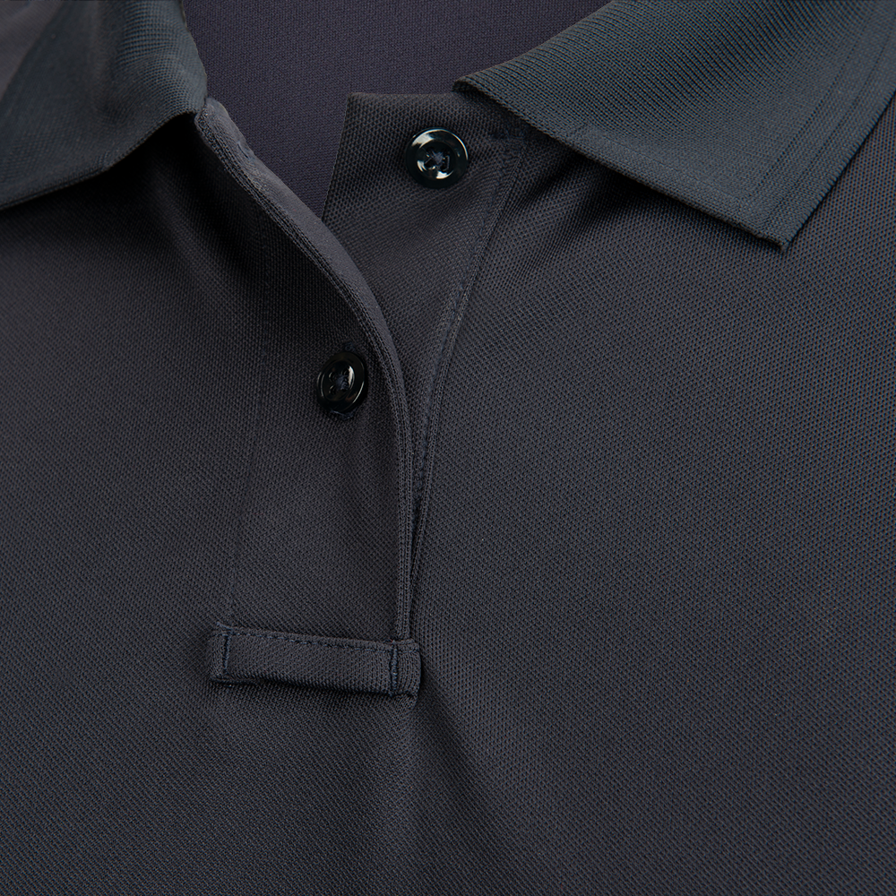 Close-up photograph of a dark gray pique polo shirt showcasing its collar, button placket, and a small chest pocket featuring a subtle textured weave and dark buttons