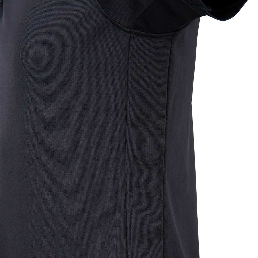 Close-up photograph of a dark navy blue polo shirt showing textured fabric a subtle seam and a hint of a collar