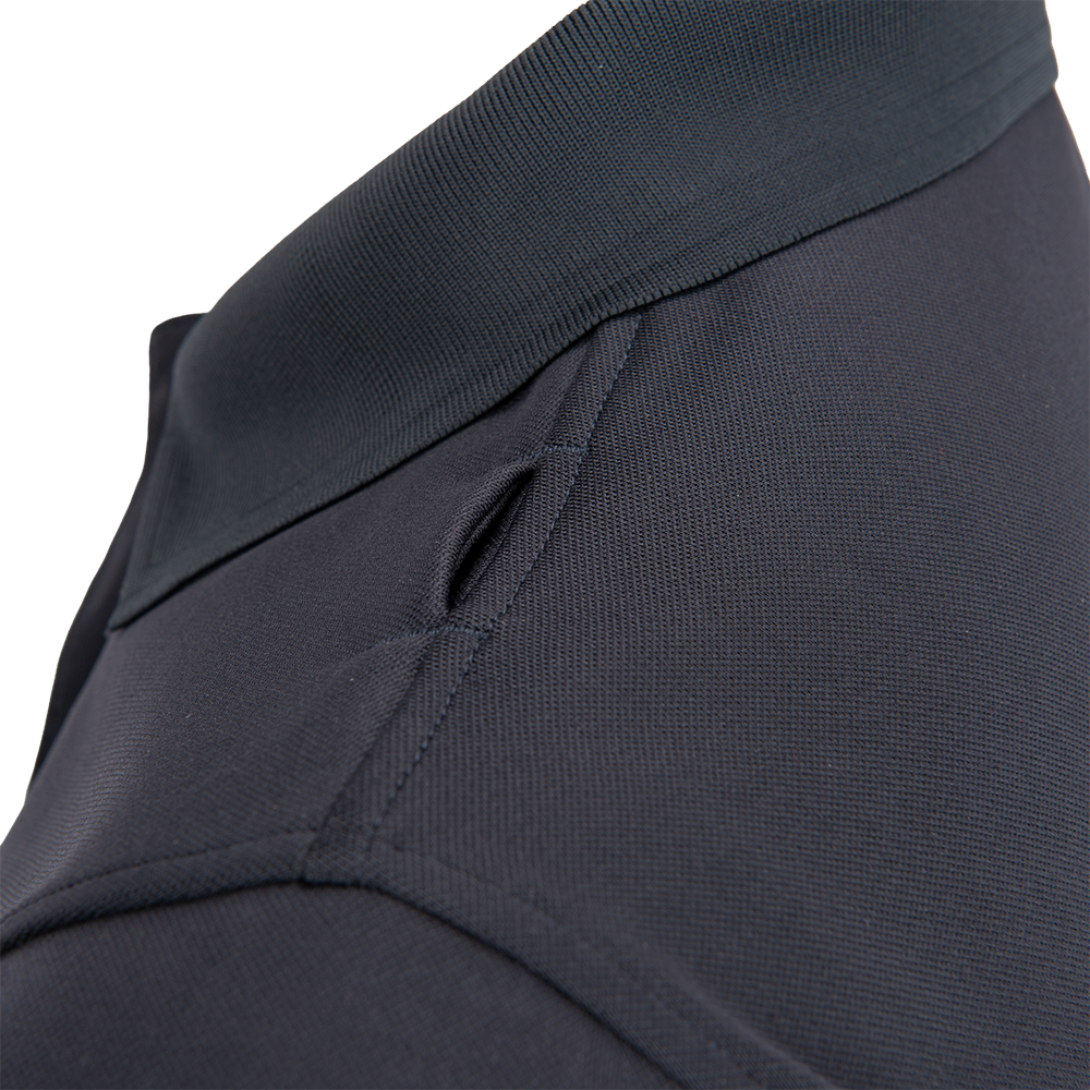 Close-up detail shot of a dark gray polo shirt collar showing a tightly woven fabric texture a reinforced neckband and a subtly contrasting stitch detail