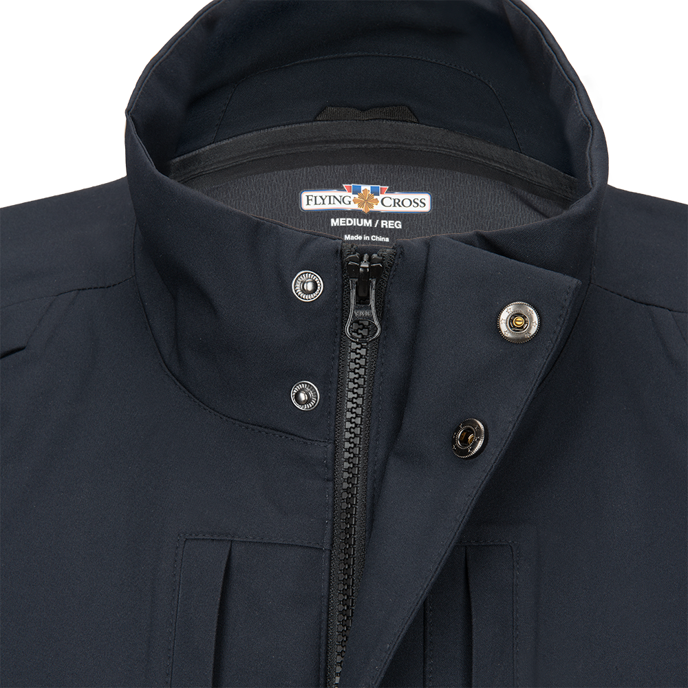 Close-up of a Flying Cross medium navy jacket showing a zipper, metallic buttons and interior label