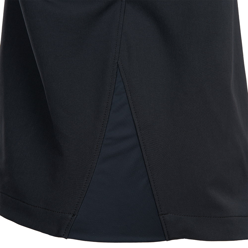 Close-up of black fabric showing a detailed rear view with a central seam and subtle texture variations