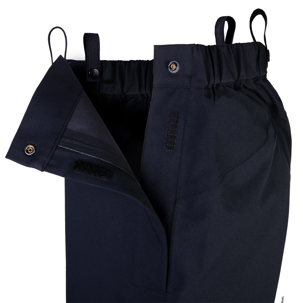 Product shot showing black waterproof pants with snap closures adjustable waistband and mesh lining