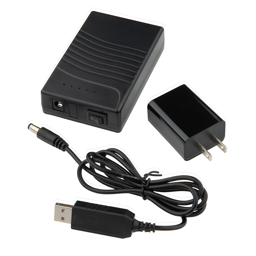 Product shot showing a black power adapter with a USB cable a power cord and a power brick with a switch and indicator lights