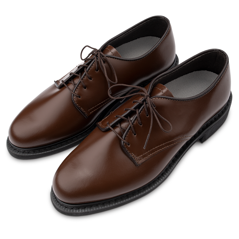 Product shot of a pair of brown leather oxford shoes with dark laces and a thick sole against a white background