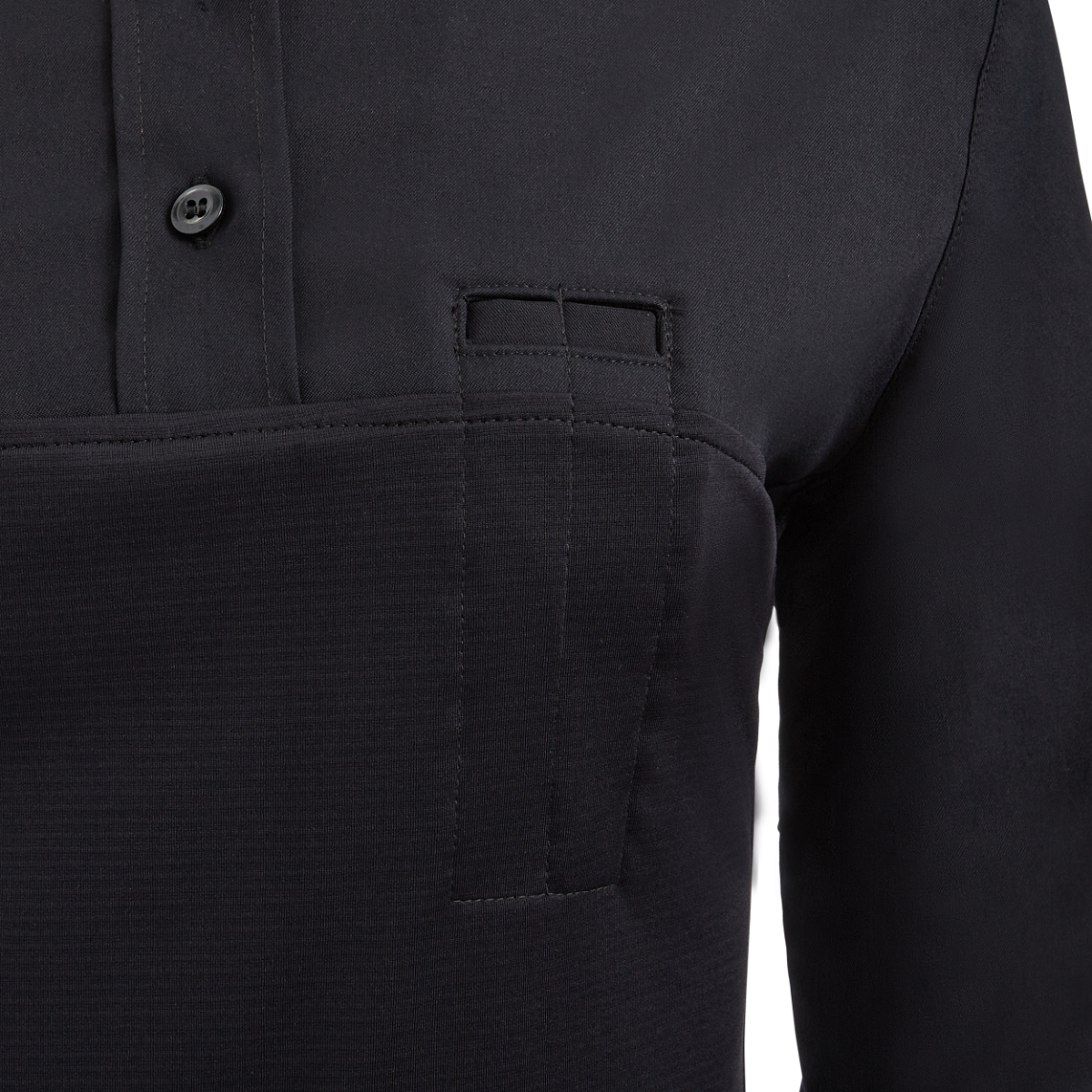 Close-up of a black long-sleeved shirt showing a unique three-slot pocket detail, subtle stitching, and a two-button placket