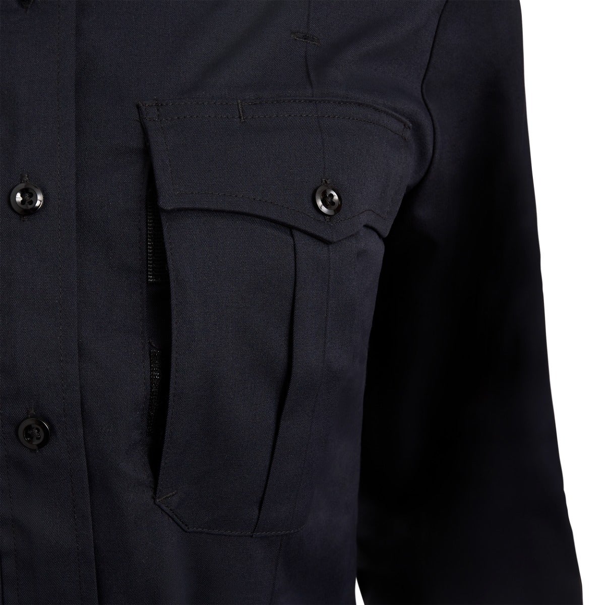 Close-up of a dark navy blue long sleeve shirt featuring a zippered pocket and two dark buttons showing subtle stitching details