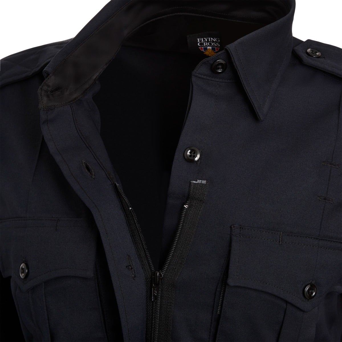 Close-up of a Flying Cross navy blue long sleeve shirt showing the collar, zipper, and button details