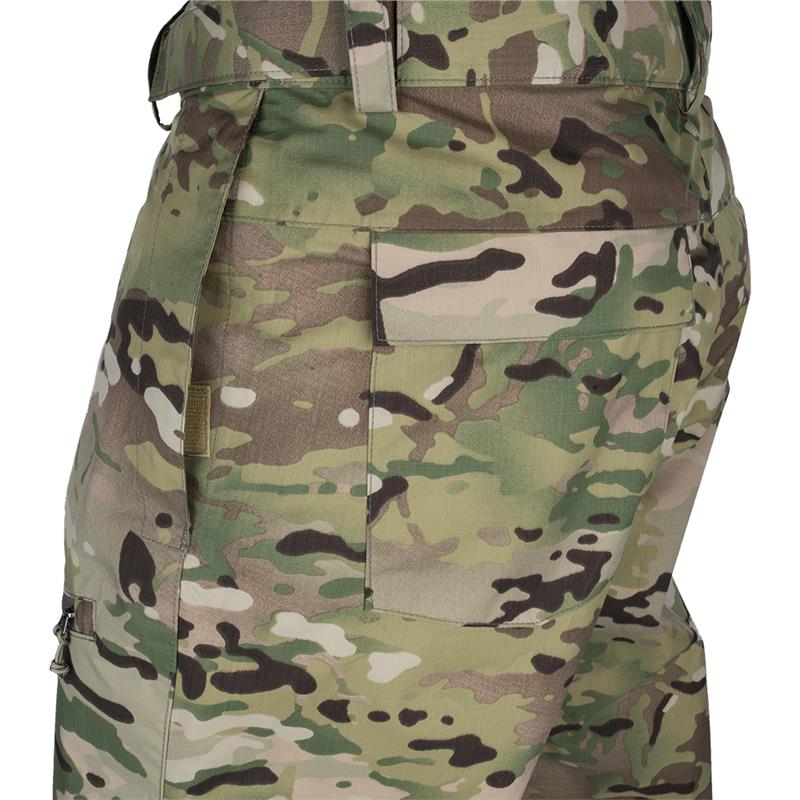 Close-up product shot of camouflage pants featuring a back pocket and subtle variations in green brown and tan hues showcasing a sturdy fabric and secure zipper detail