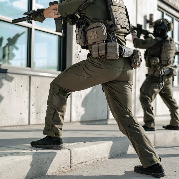 Photograph Police tactical gear olive green pants knee pads modern building SWAT team action