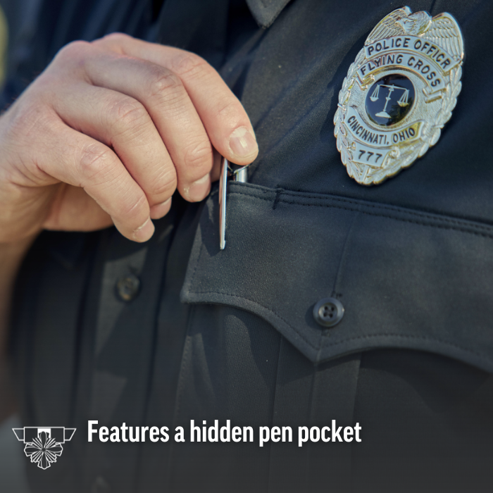 Close-up photography of a police uniform showing a hand inserting a pen into a hidden pocket the dark fabric features a Cincinnati Ohio Police Flying Cross badge with a silver eagle and scales of justice a shiny pen and dark buttons are visible