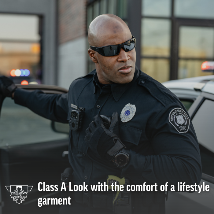 Photograph Springfield City Police officer in uniform next to a police car wearing black gloves and sunglasses with a body camera visible and a police badge featuring a star and laurel wreath