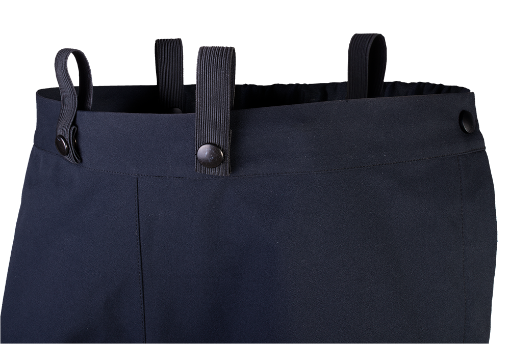 Close-up of dark navy blue women's trousers featuring elastic suspenders and dark buttons showing fine detail and texture