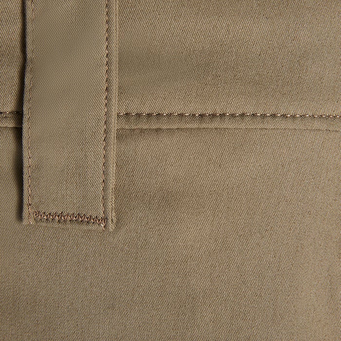 Close-up detail of a khaki twill fabric showing subtle texture, parallel stitching, and a contrasting brown topstitching