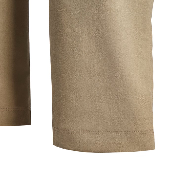 Close-up detail of khaki fabric showing subtle texture and even stitching at the hem