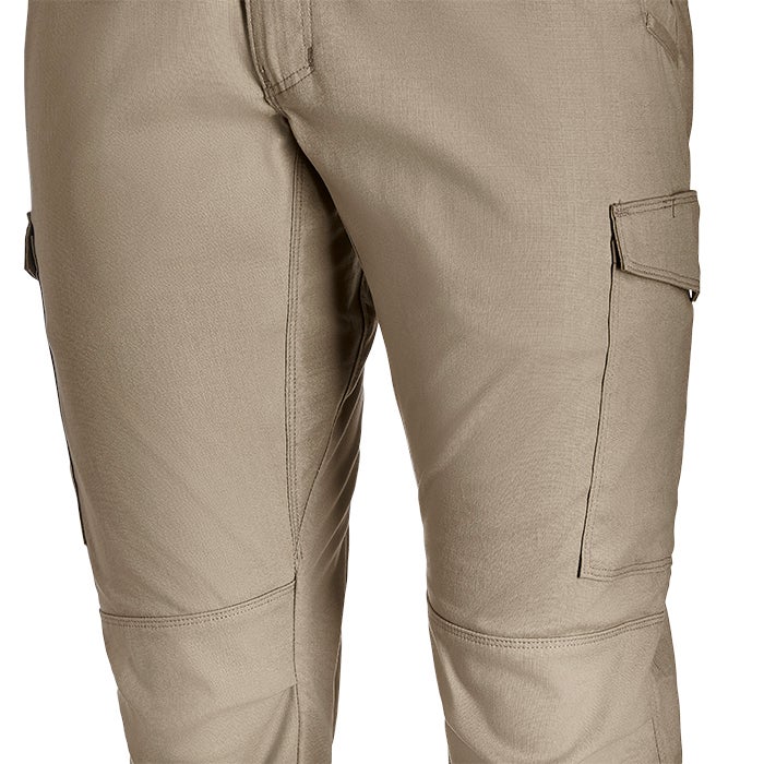 Close-up product shot of beige tactical cargo pants showcasing reinforced knees and multiple pockets with subtle stitching details