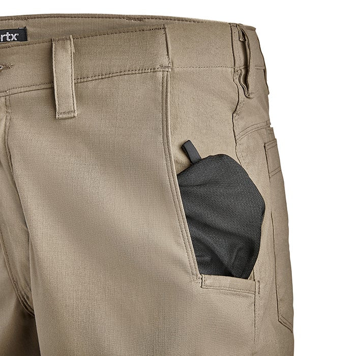 Close-up product shot of tan 5.11 tactical pants showing a black, fabric-lined pocket a visible label and subtle stitching details