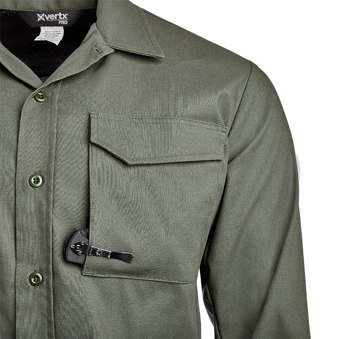 Product shot of a Vertx Pro olive green work shirt featuring a button-down collar, multiple pockets, and a hidden knife detail showcasing durable fabric and subtle stitching