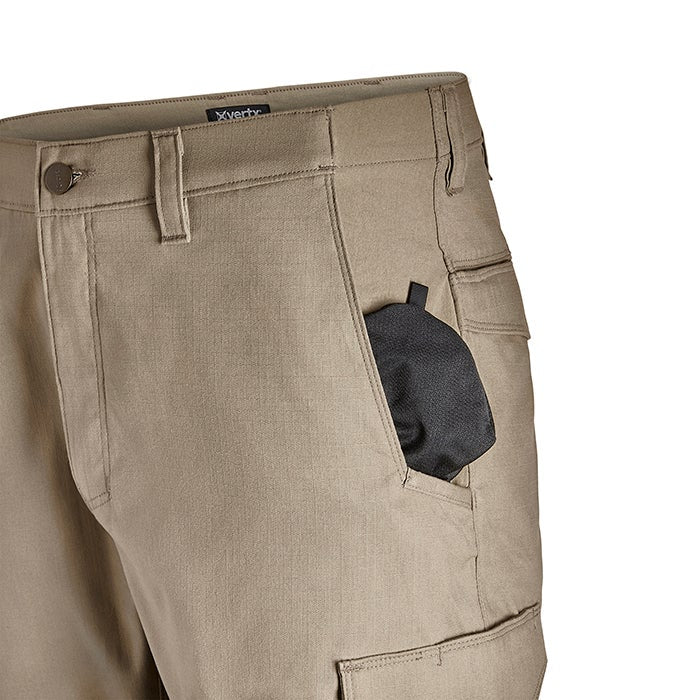 Close-up product shot of tan Xerty cargo pants showing a side pocket with a black accessory a button fly and detailed stitching