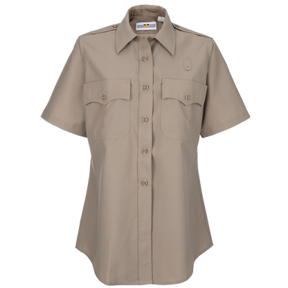 Product shot of a tan Flying Cross women's short-sleeve uniform shirt featuring two chest pockets, button-down front, and a subtle logo  
