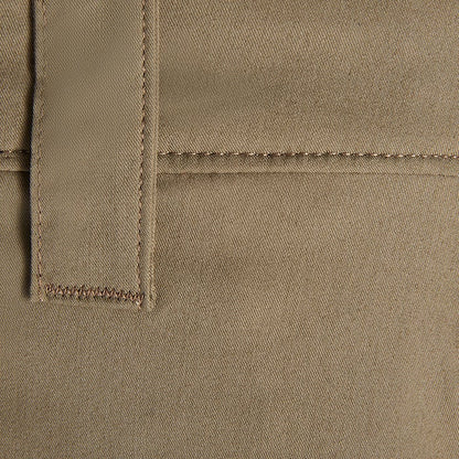 Close-up detail of a khaki twill fabric showing subtle texture, parallel stitching, and a contrasting brown topstitching