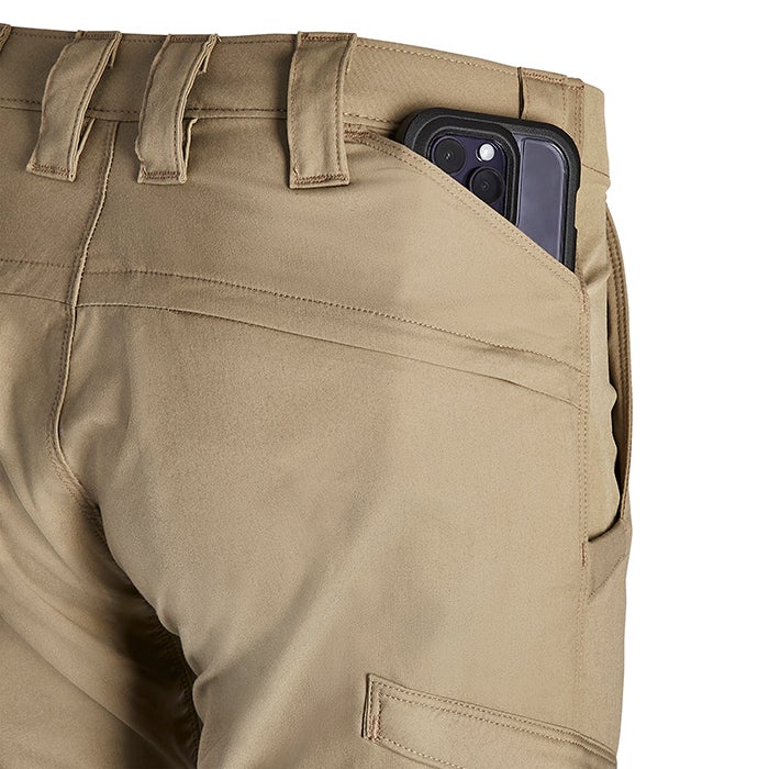 Product shot of tan tactical pants with a smartphone in the back pocket showing detailed stitching and reinforced seams