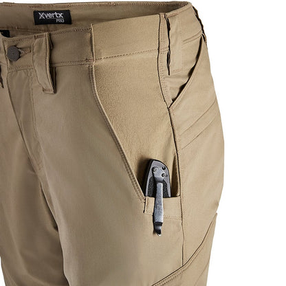 Close-up of tan X Vertx Pro pants showing multiple pockets and a black multi-tool in a side pocket showcasing the durable fabric and reinforced stitching details
