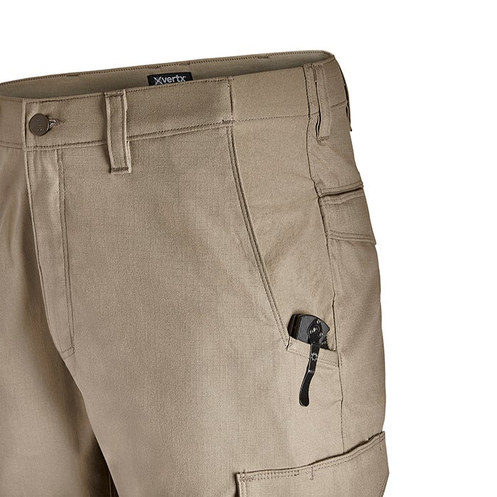 Product shot of tan Vertex pants featuring multiple pockets a knife in a pocket and a black waistband label

