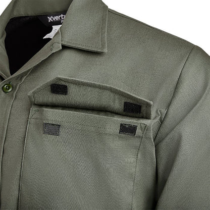 Close-up of a Vertx shirt showing olive green fabric, black hook and loop closures on double chest pockets and a buttoned collar
