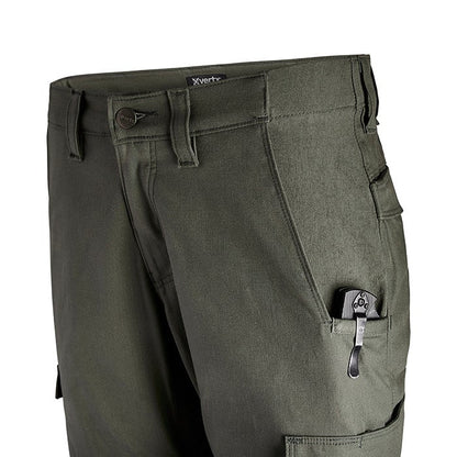 Product shot of XVertx tactical pants showing a dark olive green fabric, multiple pockets including a cargo pocket with a black folding knife visible, and a buttoned waistband
